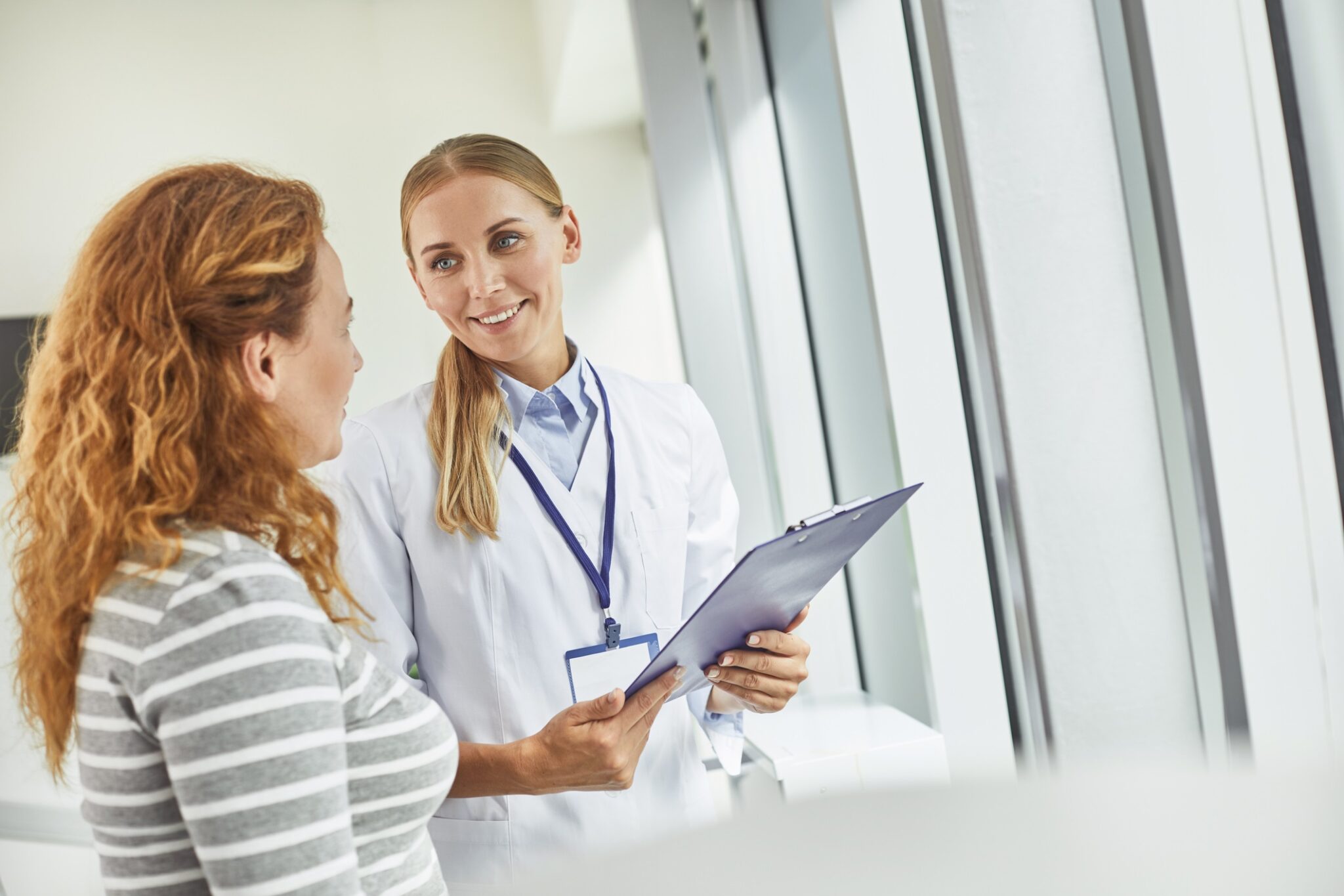 Healthcare professional consulting a patient in a clinic setting